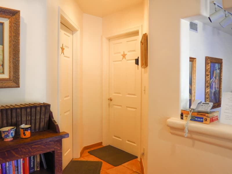 Nick & Nora bathroom and bedroom doors from the hall